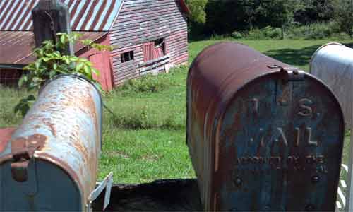 Mail box and old red barn